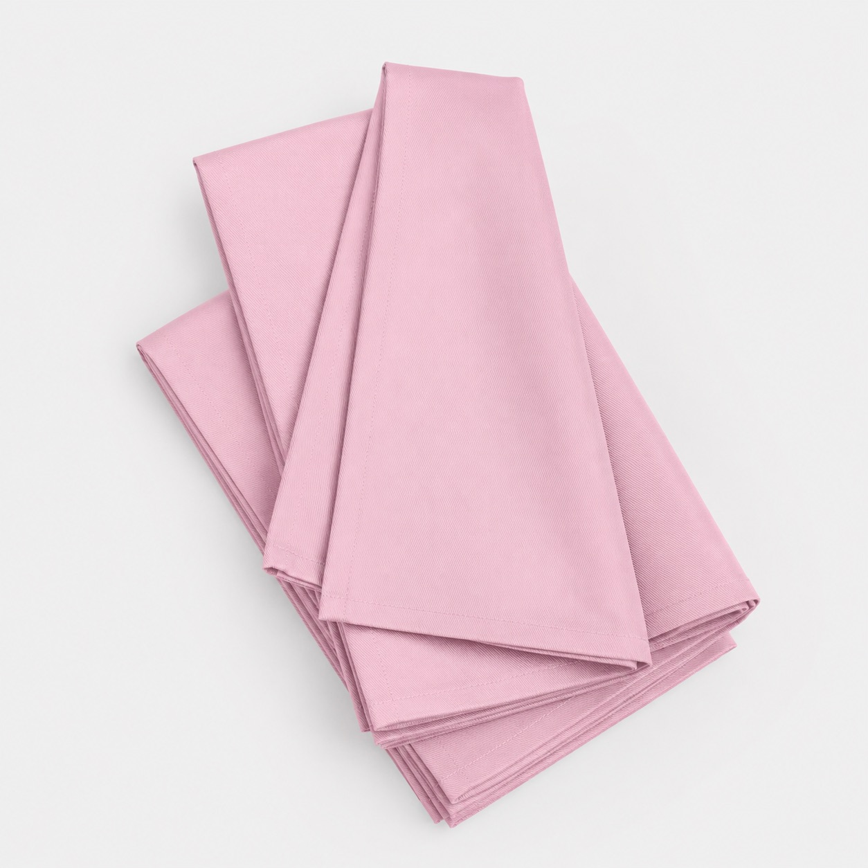 Stack of folded Utopia Kitchen cloth napkins, studio shot
